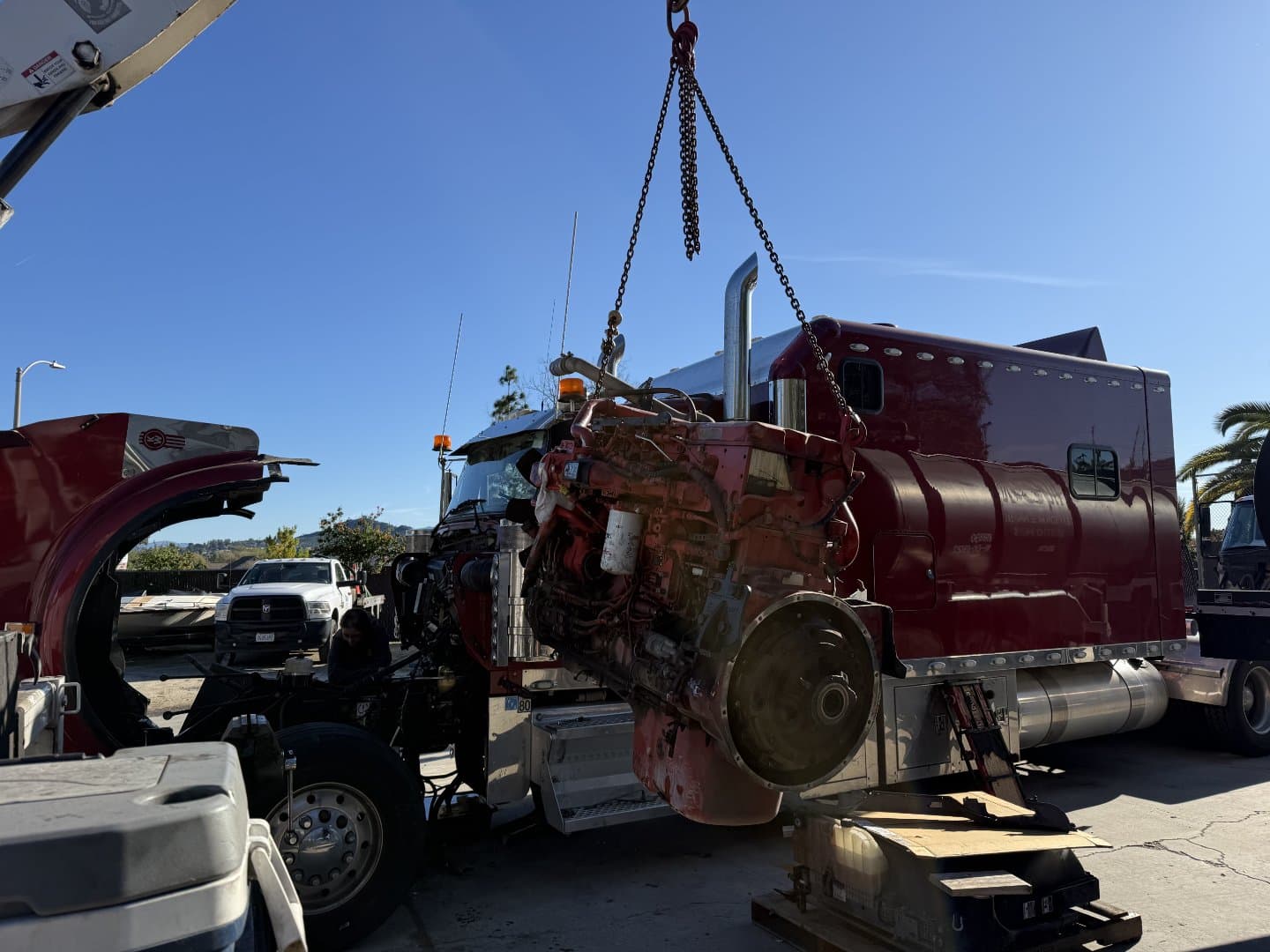 Diesel engine being lifted during commercial vehicle service